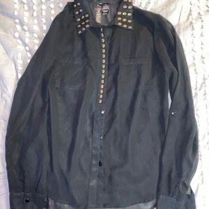 Sheer black top with metal skulls